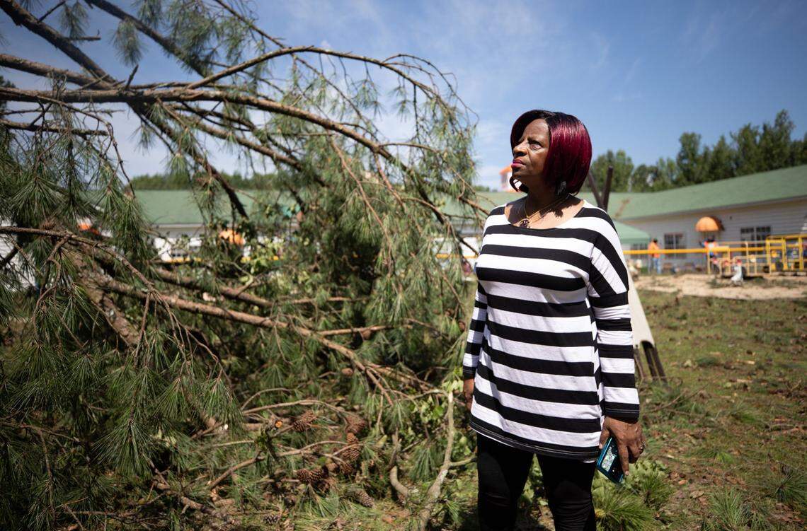 Carolyn Slade, director of St. Stephen Loving Daycare Center in Rocky Mount, N.C., stands outside the building on Thursday, July 20, 2023. A tornado swept through the area on Wednesday, downing trees and power lines around the property. Slade said the building was unharmed and no one at the daycare was injured.