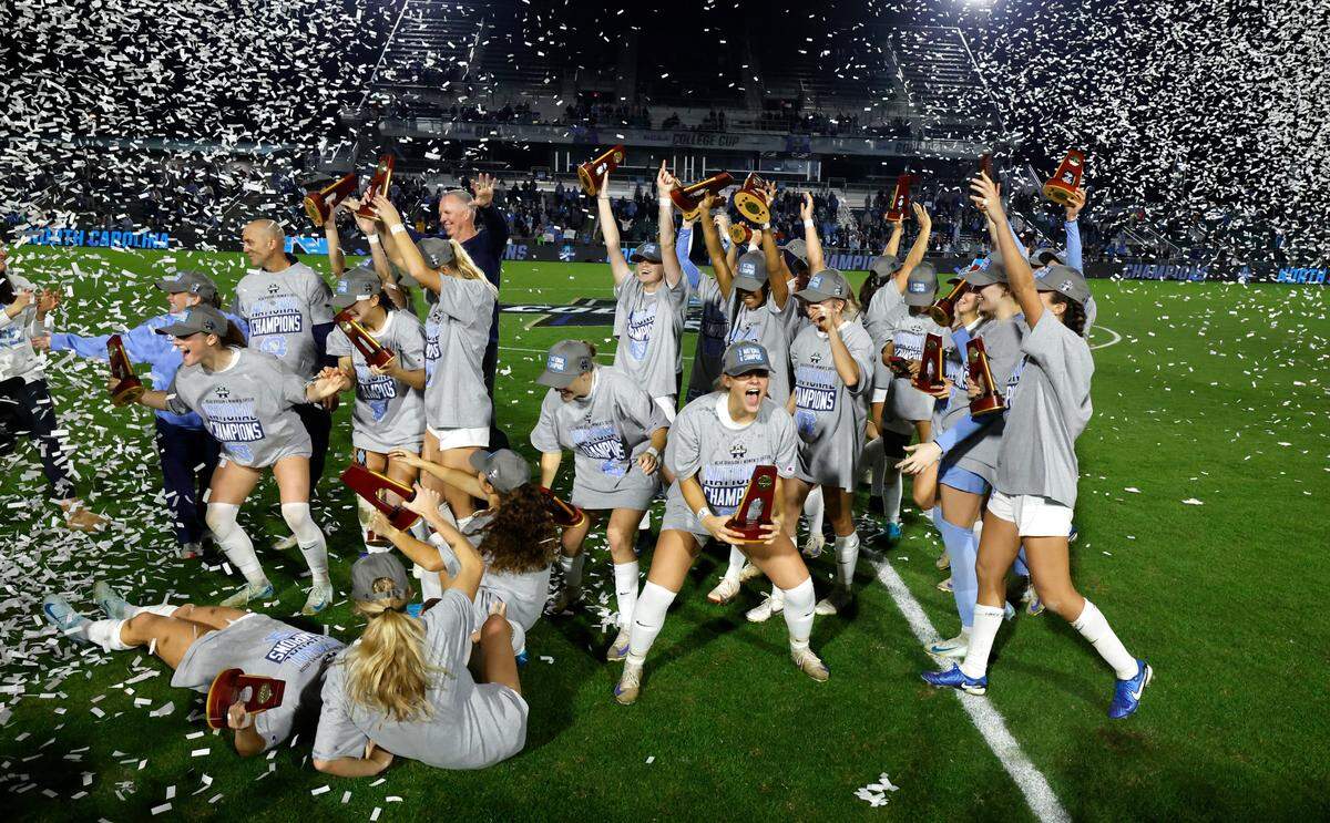 North Carolina players celebrate after UNC’s 1-0 victory over Wake Forest in the finals of the 2024 Women’s College Cup at WakeMed Soccer Park in Cary, N.C., Monday, Dec. 9, 2024.