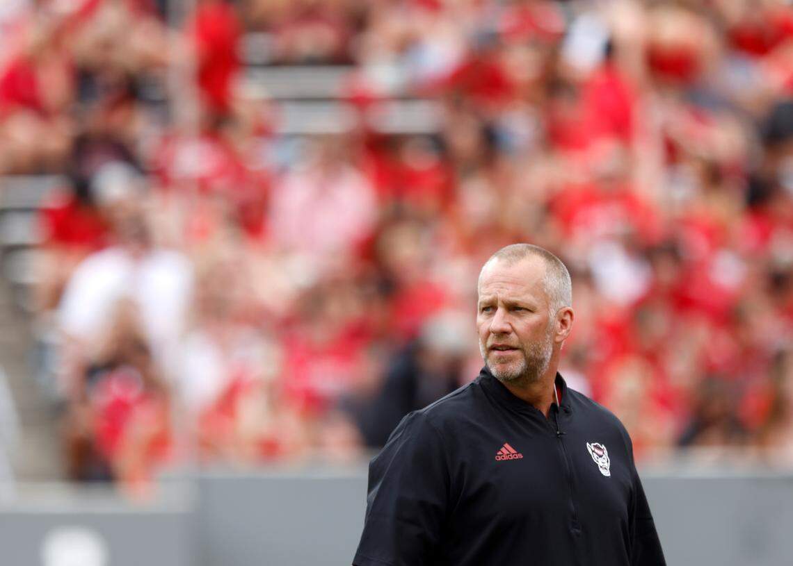 N.C. State head coach Dave Doeren watches as his team warms up prior to a game against Charleston Southern on Saturday, Sept. 10, 2022, at Carter-Finley Stadium in Raleigh, N.C.
