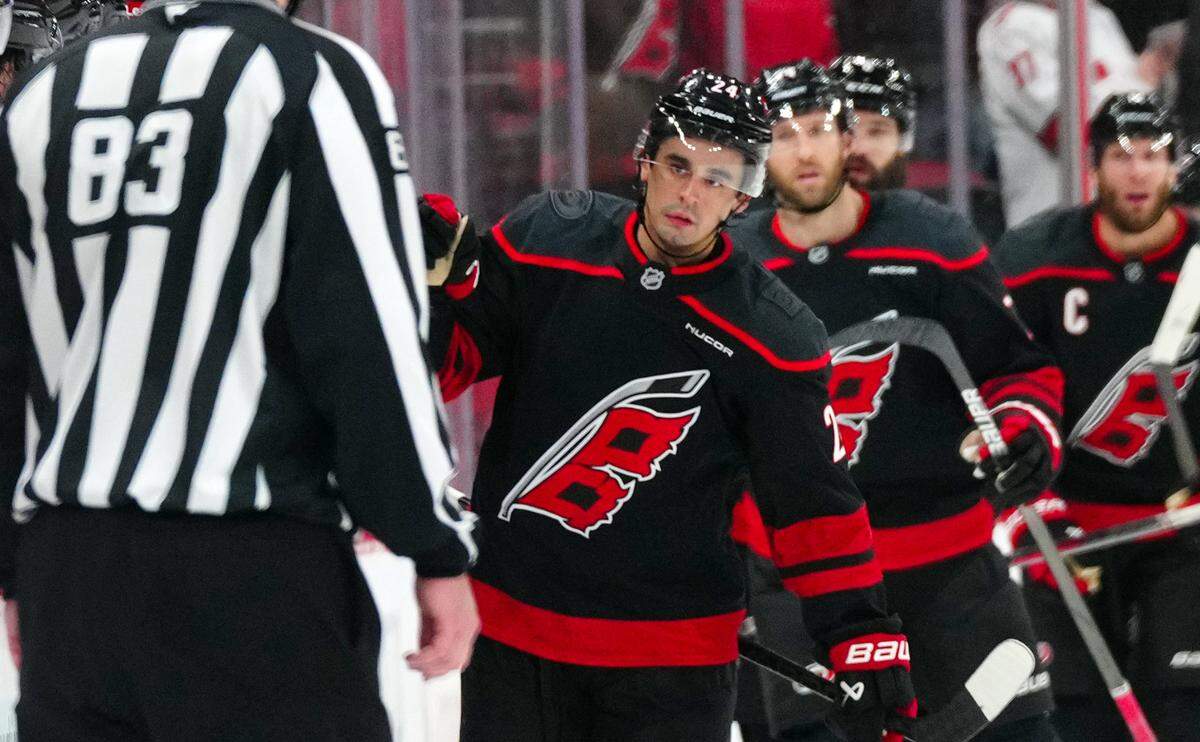 Jan 5, 2025; Raleigh, North Carolina, USA; Carolina Hurricanes center Seth Jarvis (24) celebrates his goal against the Pittsburgh Penguins during the second period at Lenovo Center. Mandatory Credit: James Guillory-Imagn Images