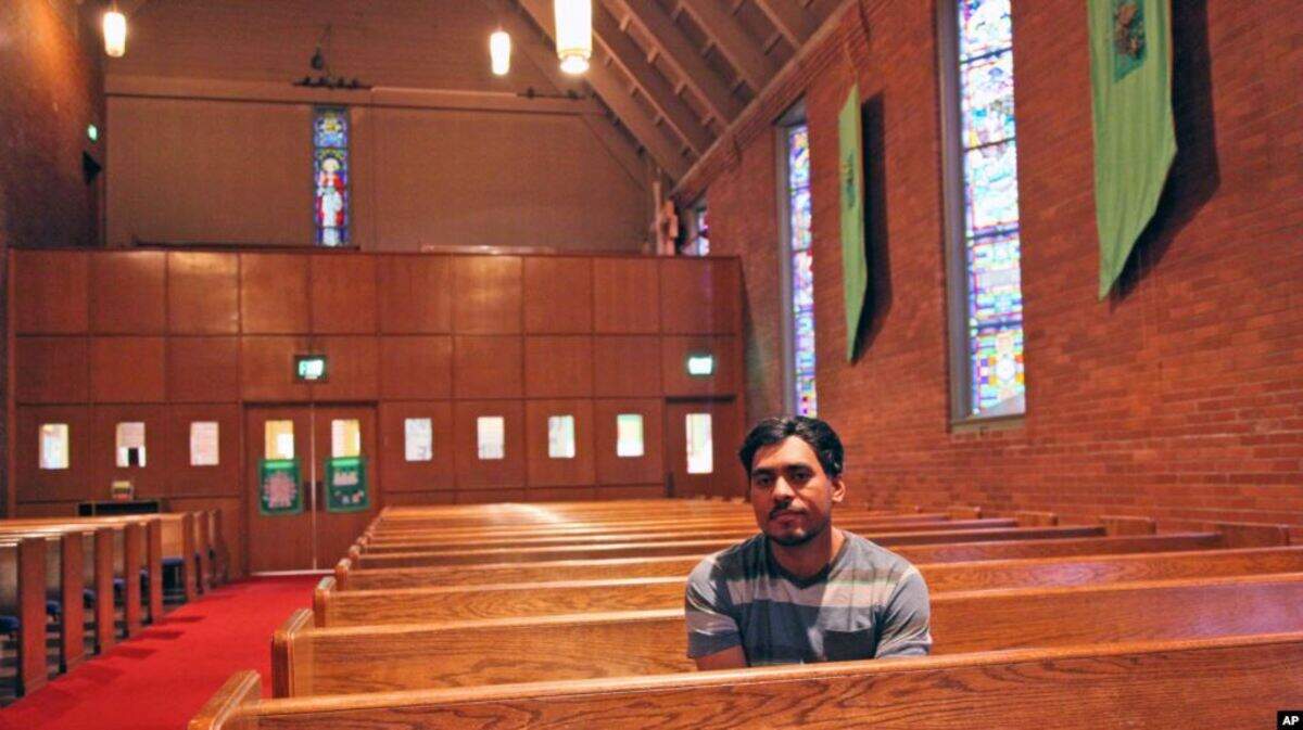 Francisco Aguirre Velasquez poses at Augustana Lutheran Church in Portland, Ore. Aguirre, an immigrant, took refuge at the church to avoid deportation. Photo taken July 6, 2015. The author says the sanctuary movement is a example of people practicing servant leadership. (AP Photo).