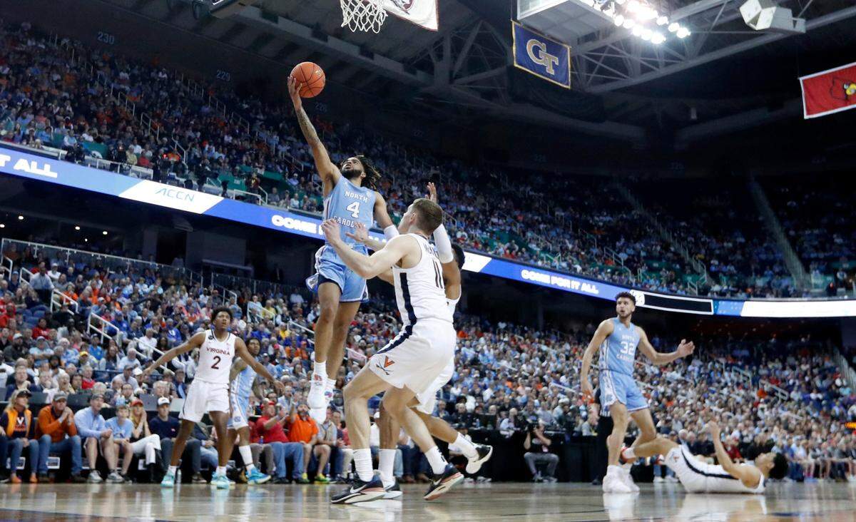 North Carolina’s RJ Davis (4) heads to the basket during the first half of UNC’s game against Virginia in the quarterfinals of the ACC Men’s Basketball Tournament in Greensboro, N.C., Thursday, March 9, 2023.