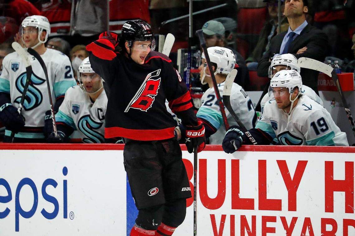 Carolina Hurricanes’ Martin Necas (88) celebrates his goal as he skates past the Seattle Kraken bench during the third period of an NHL hockey game in Raleigh, N.C., Sunday, March 6, 2022. (AP Photo/Karl B DeBlaker)