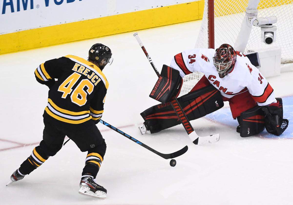 Boston Bruins center David Krejci (46) prepares to shoot and score past Carolina Hurricanes goaltender Petr Mrazek (34) during the third period of an NHL Eastern Conference Stanley Cup hockey playoff game in Toronto, Wednesday, Aug. 12, 2020. (Nathan Denette/The Canadian Press via AP)