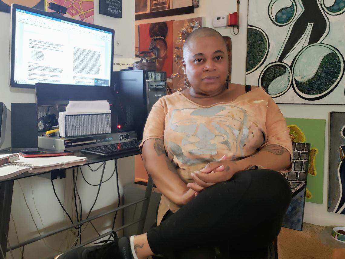 Robins Mills, mother of one of the 15 men who received part of a $2 million settlement in a federal civil rights case that contends police and informant framed more than 15 men, posed for a portrait in her apartment on Sept. 29, 2021.
