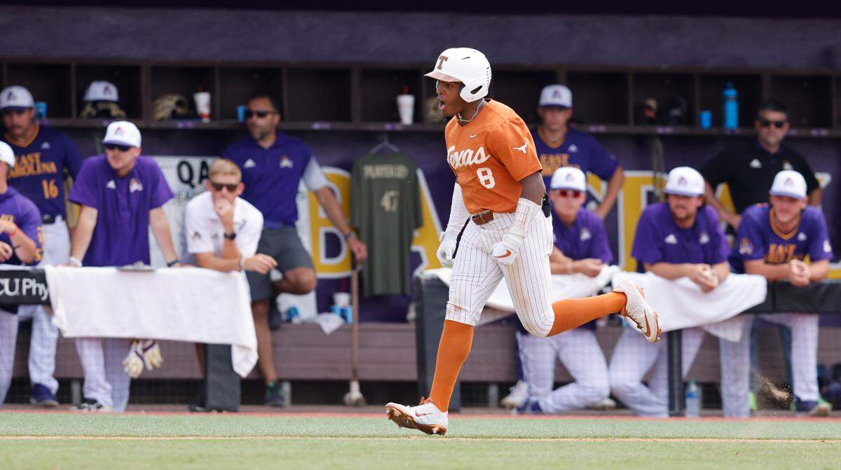 Texas’ Dylan Campbell (8) celebrates as he rounds the bases after hitting a homerun to tie the game in the bottom of the eighth during Texas’ 9-8 victory over ECU in the Greenville Super Regional at Clark-LeClair Stadium Saturday, June 11, 2022.