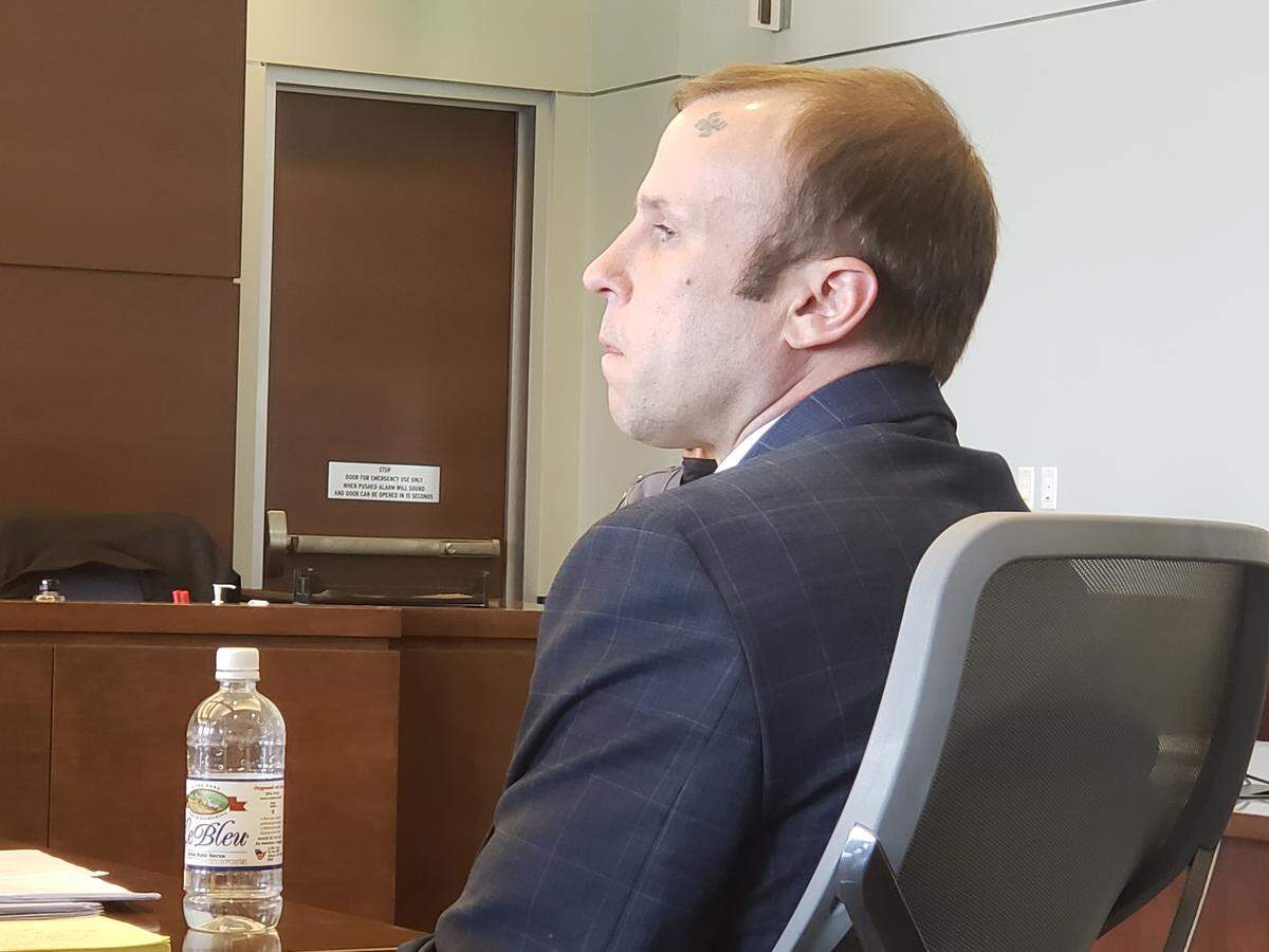 Daniel Mohar sitting in Durham County court during jury selection for his second-degree murder trial on March 22, 2022.