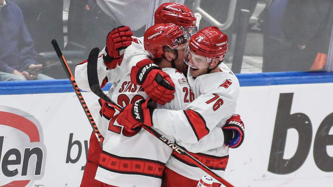 The Carolina Hurricanes celebrate after defeating the New York Islanders 2-1 in game six of the first round of the 2023 Stanley Cup Playoffs at UBS Arena.