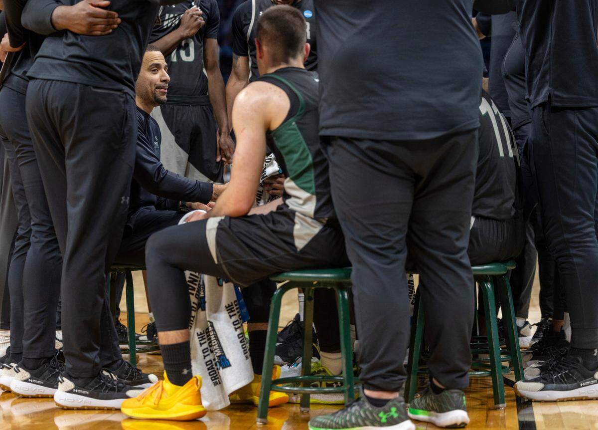 Wagner head coach Donald Copeland huddles with his team during a time out in the first half against North Carolina on Thursday, March 21, 2024 during the NCAA Tournament at Spectrum Center in Charlotte, N.C.