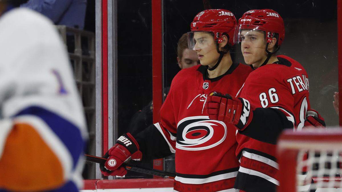 Carolina Hurricanes’ Sebastian Aho (20) of Finland, and Teuvo Teravainen (86) of Finland celebrate a goal against the New York Islanders during the second period of an NHL hockey game, Sunday, Oct. 28, 2018, in Raleigh, N.C. (AP Photo/Karl B DeBlaker)