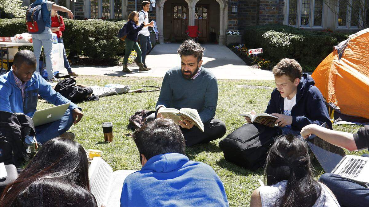 In this file photo, Duke University students gather outside for a class taught by a lecturing fellow in the Thompson Writing Program at Duke.