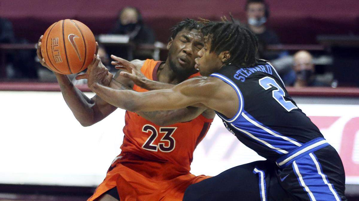Virginia Tech’s Tyrece Radford (23) has the ball stolen from him by Duke’s DJ Steward (2) during the first half of an NCAA college basketball game Tuesday, Jan. 12, 2021, in Blacksburg, Va.