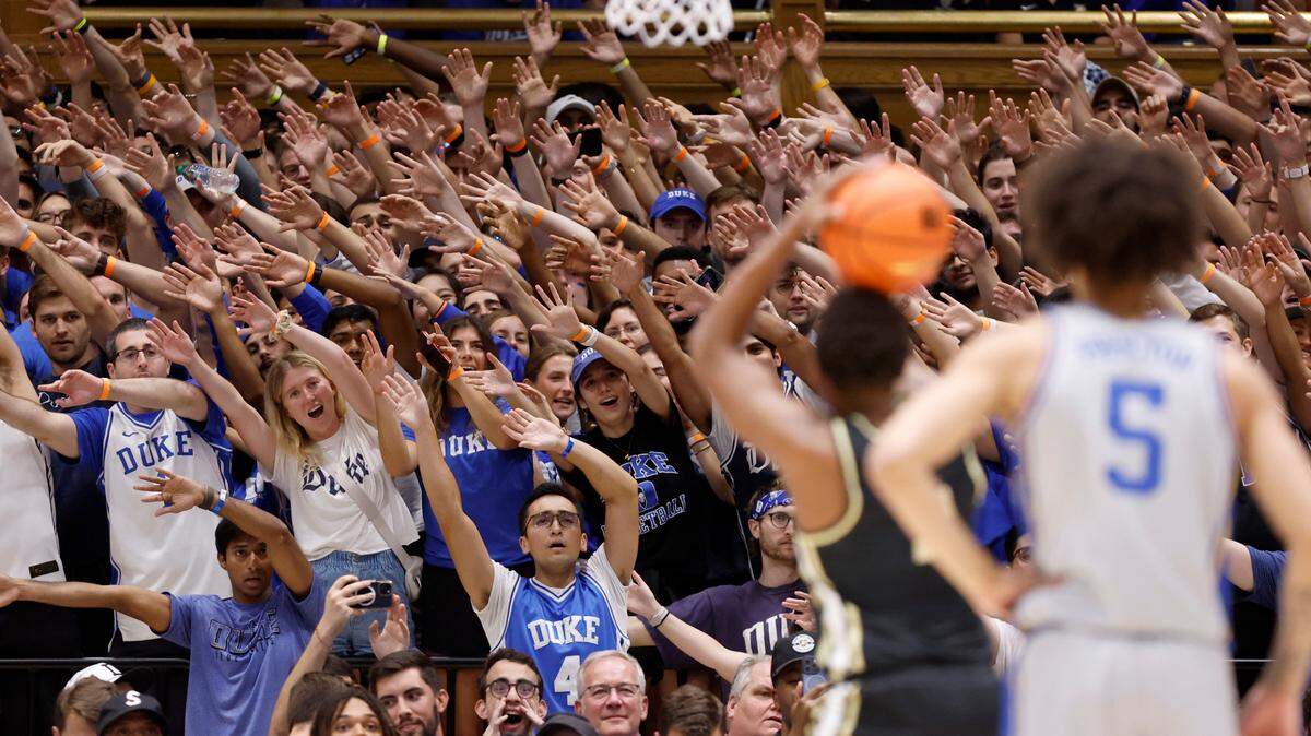 Duke fans try to distract Army’s Jalen Rucker (1) as he shoots free throws during the first half of Duke’s game against Army at Cameron Indoor Stadium in Durham, N.C., Friday, Nov. 8, 2024.
