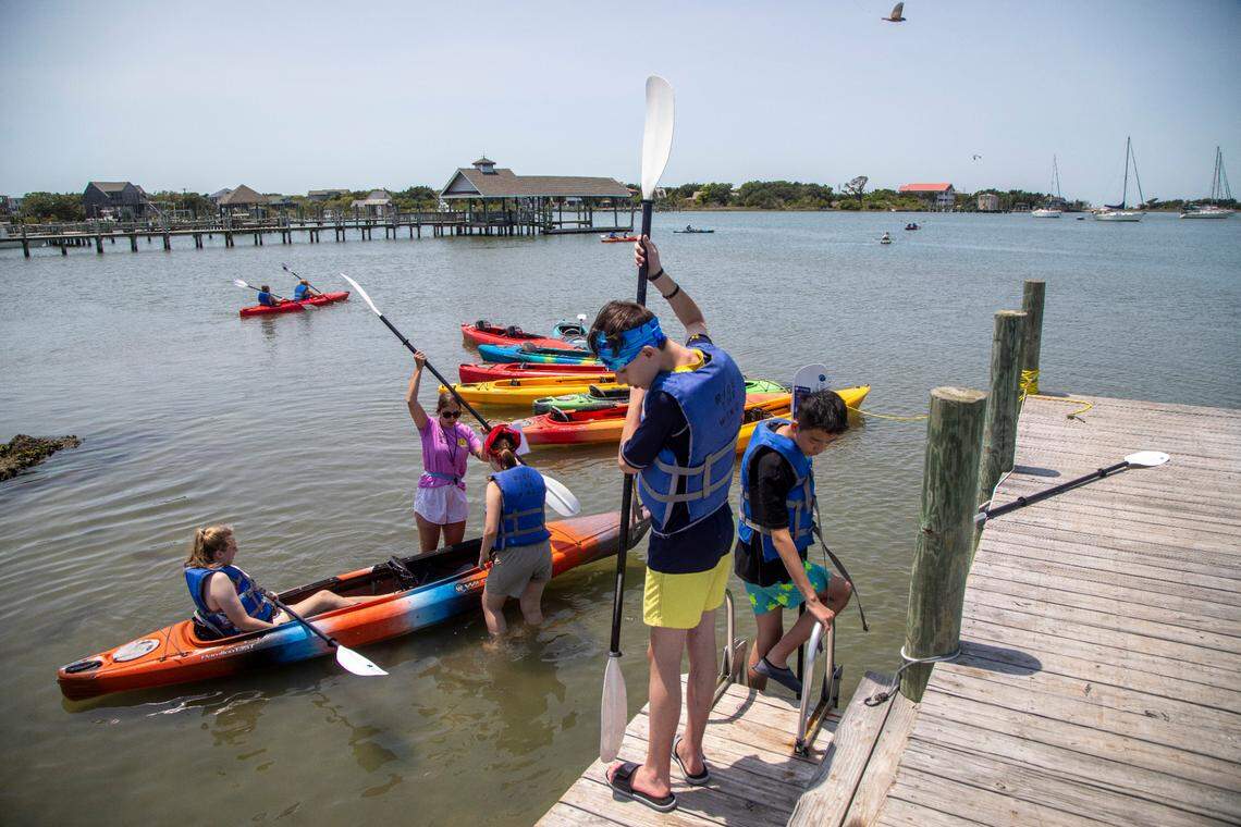 A school group prepares to paddle Silver Lake in Ocracoke Wednesday, May 18, 2022.