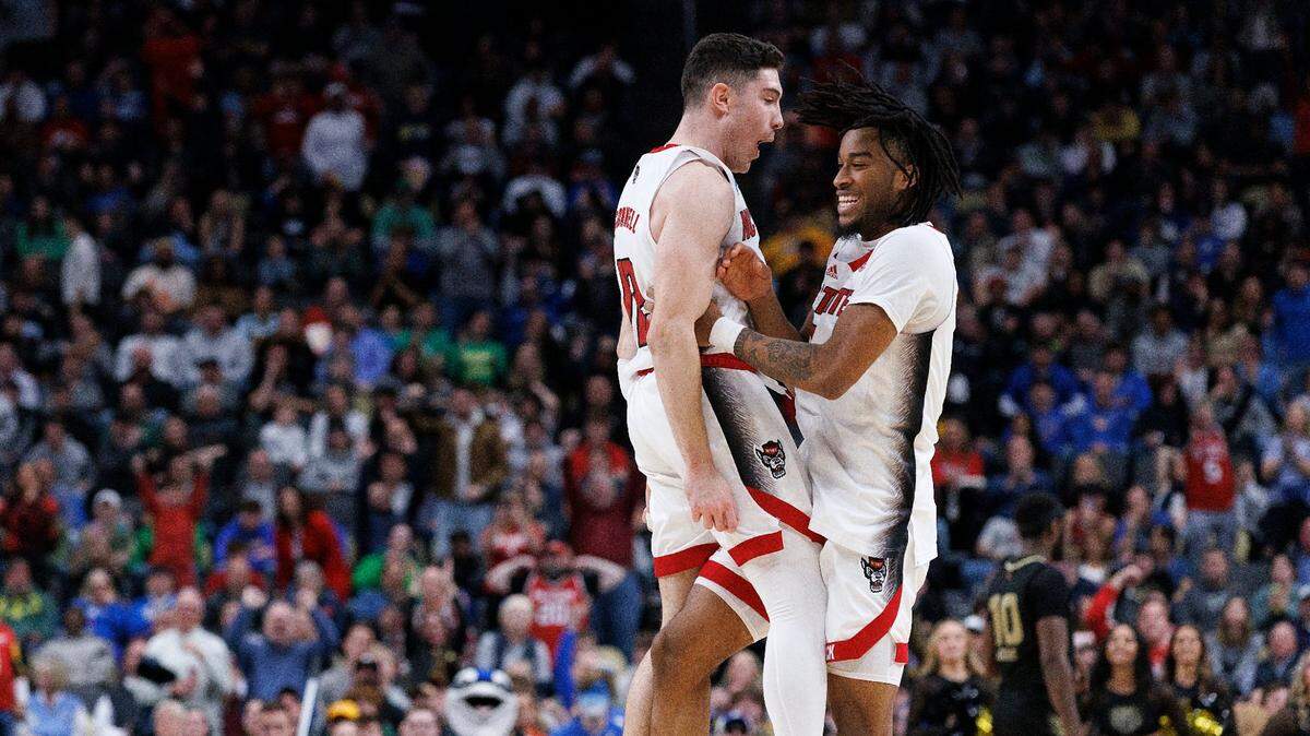 N.C. State’s Michael O’Connell and Jayden Taylor celebrate following the Wolfpack’s 79-73 overtime win against Oakland in the second round of the NCAA Tournament on Saturday, March 23, 2024, at PPG Paints Arena in Pittsburgh, Pa.
