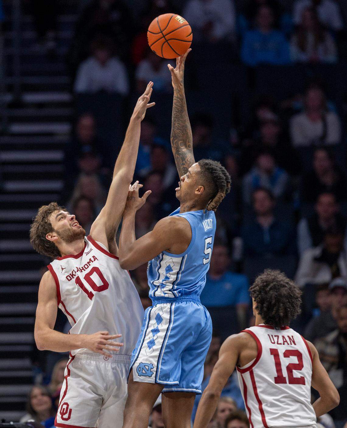 North Carolina’s Armando Bacot (5) puts up a shot against Oklahoma’s Sam Godwin (10) in the second half on Wednesday, December 20, 2023 at the Spectrum Center in Charlotte, N.C.