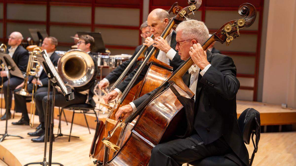 Erik Dyke, at right, in his familiar role as bassist with the NC Symphony