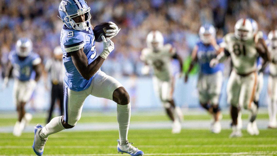 North Carolina wide receiver Devontez Walker (9) scores on an 33-yard pass completion from quarterback Drake Maye to give the Tar Heels a 28-17 lead in the third quarter against Miami on Saturday, October 14, 2023 at Kenan Stadium in Chapel Hill, N.C.
