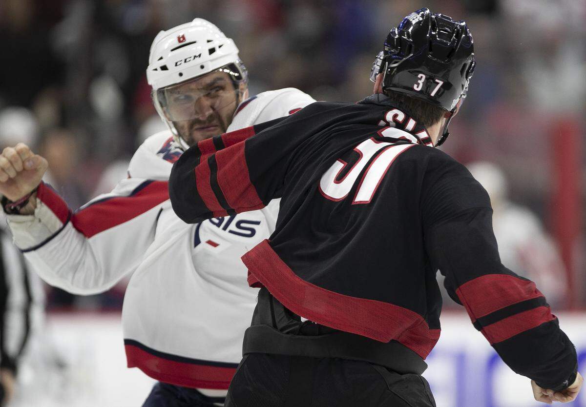 Washington Capital’s Alex Ovechkin (8) fights with Carolina Hurricanes’ Andrei Svechnikov (37) during the first period of their first round Stanley Cup game on Monday, April 15, 2019 at the PNC Arena on Raleigh, N.C.