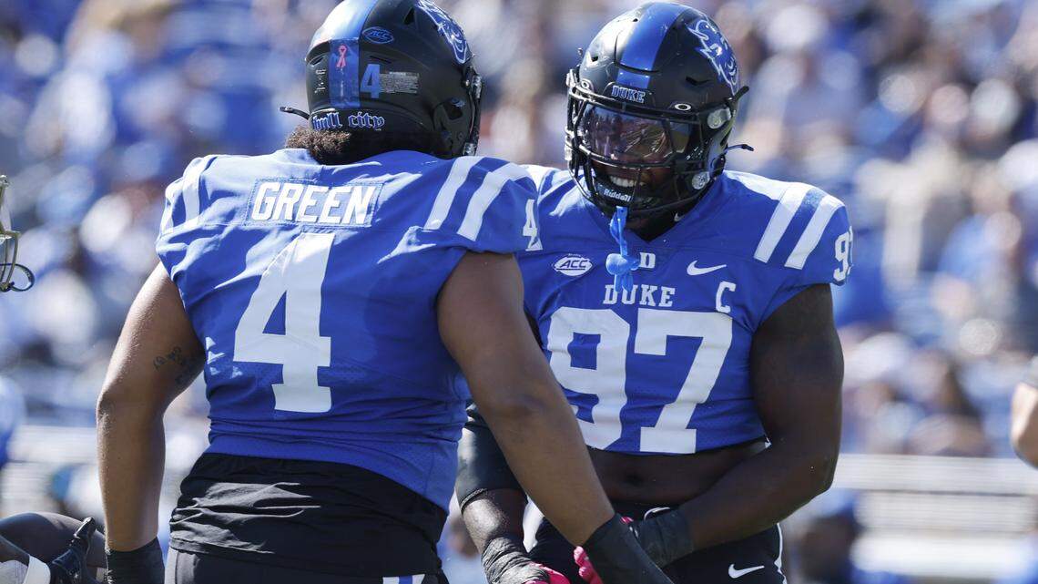 Duke’s Wesley Williams (97) celebrates with Josiah Green (4) after stopping Georgia Tech running back Jamal Haynes (1) during the first half of Duke’s game against Georgia Tech at Wallace Wade Stadium in Durham, N.C., Saturday, Oct. 18, 2025.