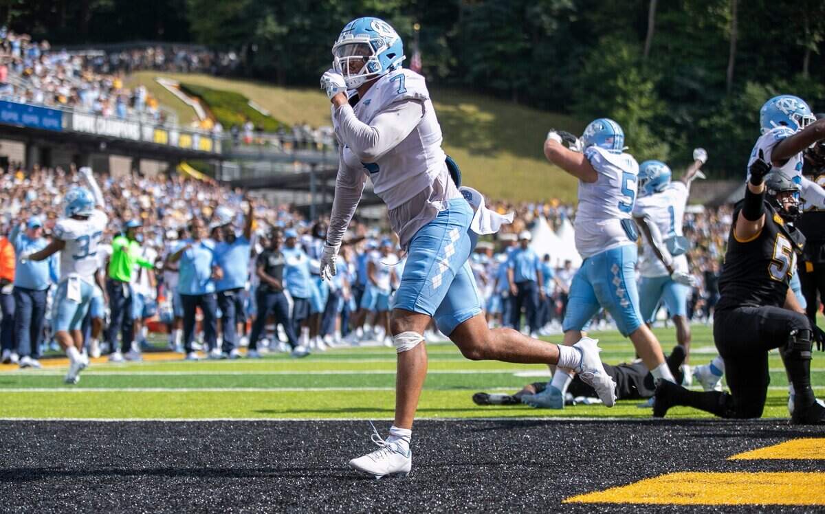 North Carolina’s Noah Taylor (7) reacts after stopping Appalachian State quarterback Chase Brice at the goal line, preventing a two-point conversion and securing North Carolinas 63-61 victory on Saturday, September 3, 2022 at Kidd Brewer Stadium in Boone, N.C.