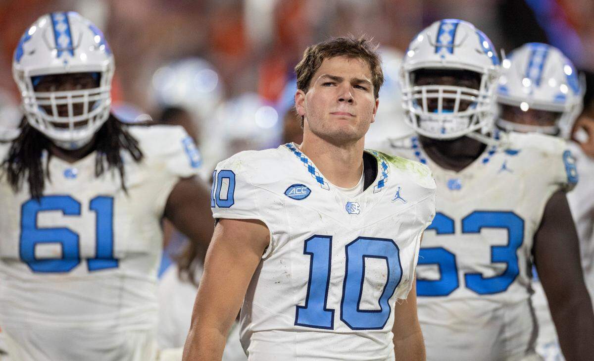 North Carolina quarterback Drake Maye (10) watches a replay of his interception by Clemson’s Nate Wiggins with 2:36 to play in the game to secure a 31-20 victory by the Tigers on Saturday, November 18, 2023 at Memorial Stadium in Clemson, S.C