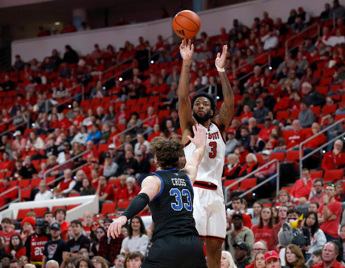 N.C. State’s Dontrez Styles shoots over Southern Methodist’s Matt Cross during the first half of the Wolfpack’s 63-57 loss on Saturday, Jan. 25, 2025, at Lenovo Center in Raleigh, N.C.