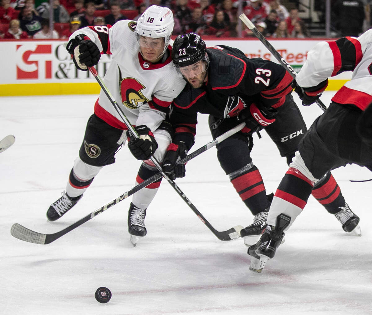 Carolina Hurricanes’ Stefan Noesen (23) battles with Ottawa’s Tim Stutzle (18) for control of the puck during the first period on Tuesday, April 4, 2023 at PNC Arena in Raleigh, N.C.