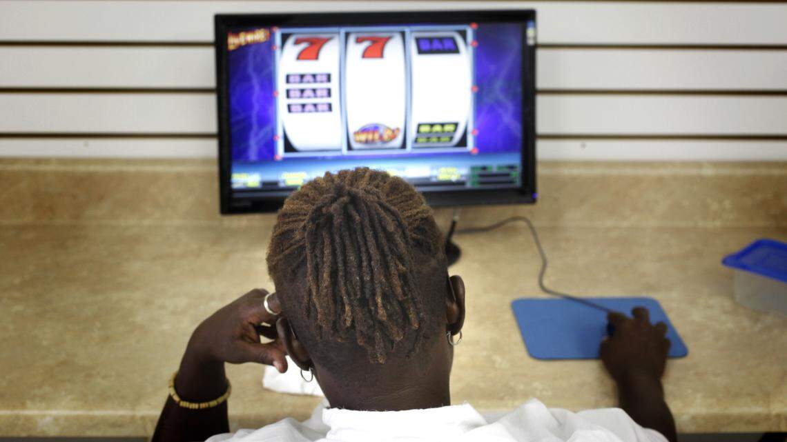 A 2010 file photo shows a woman playing a sweepstakes game at a parlor in Raleigh. A more recent version of video sweepstakes games was struck down in the North Carolina Court of Appeals on Tuesday, Oct. 15, 2019.