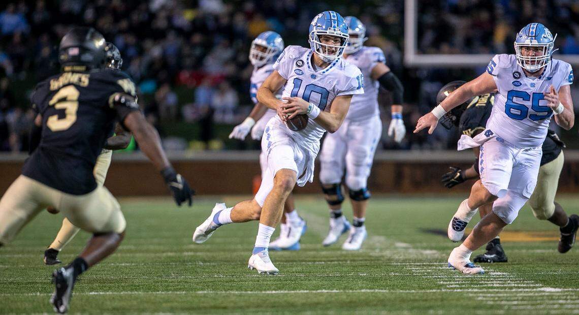 North Carolina quarterback Drake Maye (10) rushes for ten yards in the third quarter against Wake Forest on Saturday, November 12, 2022 at Truist Field in Winston-Salem, N.C.