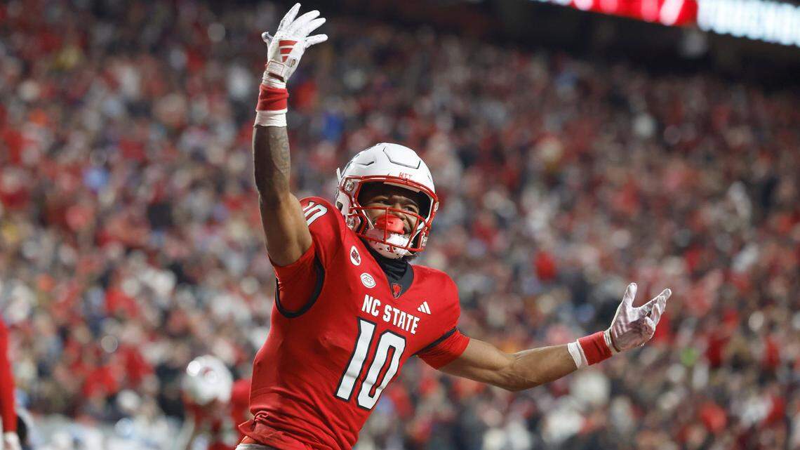 N.C. State wide receiver KC Concepcion (10) celebrates after scoring on a 11-yard touchdown reception during the first half of N.C. State’s game against UNC at Carter-Finley Stadium in Raleigh, N.C., Saturday, Nov. 25, 2023.