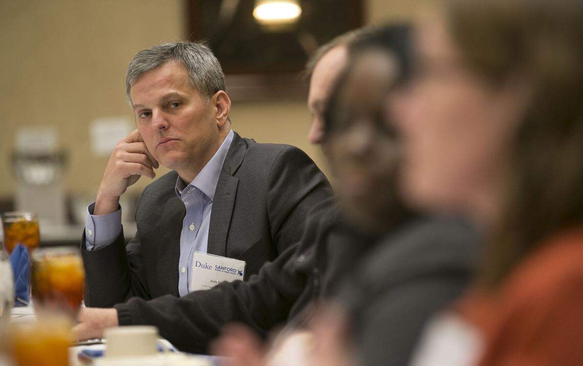 North Carolina Attorney General Josh Stein listens to Duke scientist Katie Rosanbalm during a roundtable discussion on the opioid crisis in North Carolina hosted by Duke University on Wednesday, April 11, 2018 in Research Triangle Park, N.C.