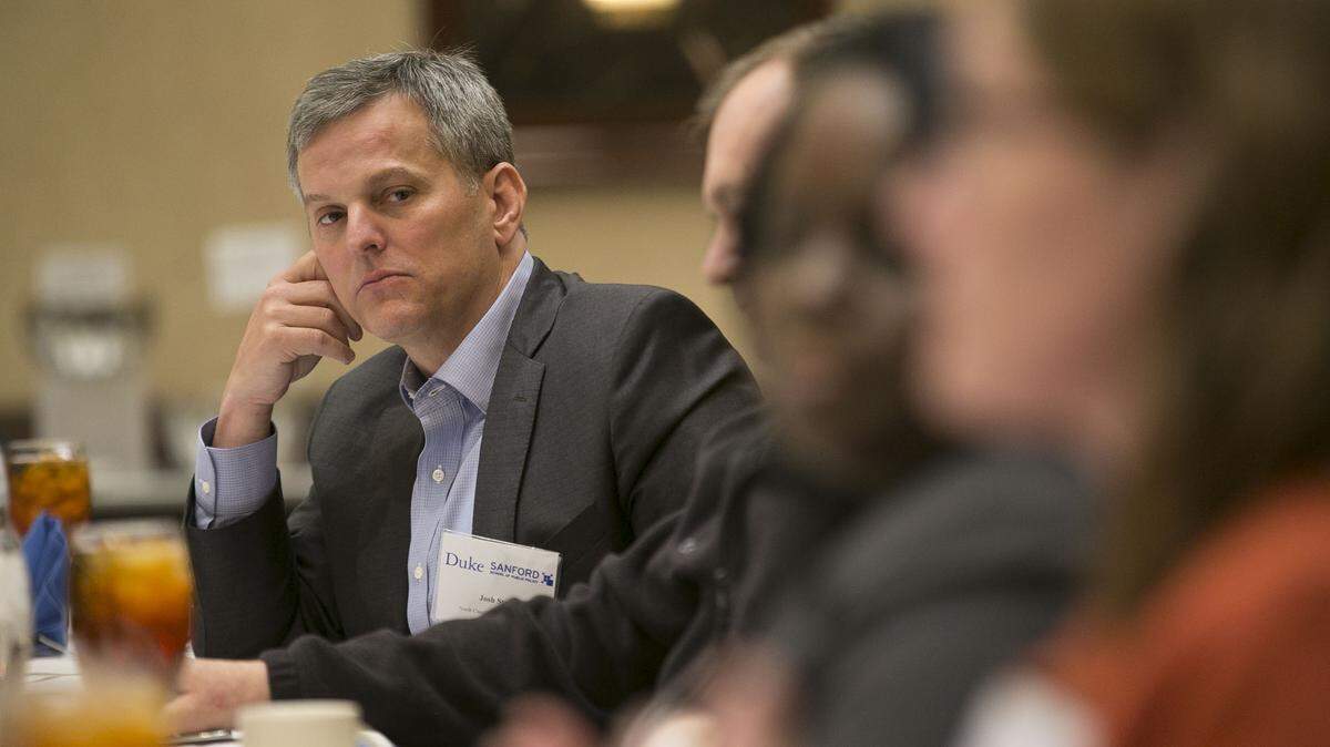 North Carolina Attorney General Josh Stein listens to Duke scientist Katie Rosanbalm during a roundtable discussion on the opioid crisis in North Carolina hosted by Duke University on Wednesday, April 11, 2018 in Research Triangle Park, N.C.