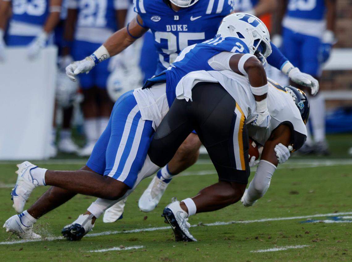 Duke Blue Devils defensive back Jaylen Stinson tackles North Carolina A&T Aggies wide receiver Jamison Warren during the first half of Dukes game against North Carolina A&T at Wallace Wade Stadium in Durham, N.C. on Saturday, Sept. 17, 2022.