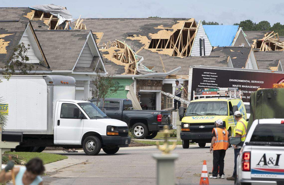 An army of home repair specialists work in the The Farm at Brunswick subdivision on Friday, September 6, 2019 in Carolina Shores, N.C., working to repair 40 homes that were damaged by a tornado spawned by Hurricane Dorian on Thursday morning, September 5, 2019.