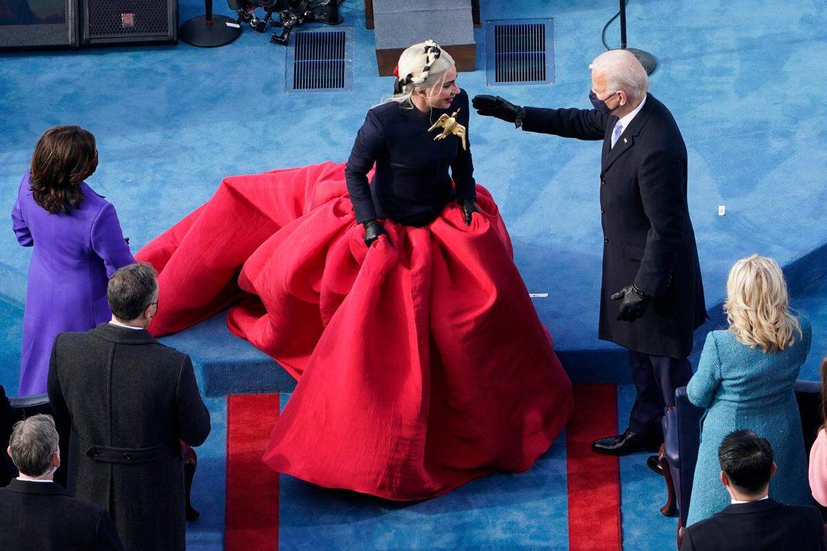 President-elect Joe Biden greets Lady Gaga during the 59th Presidential Inauguration at the U.S. Capitol in Washington, Wednesday, Jan. 20, 2021.