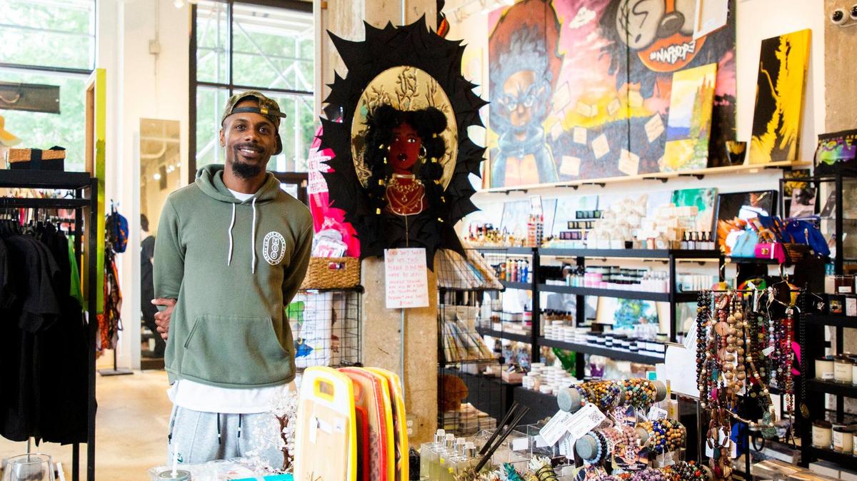 Johnny Hackett stands for a portrait inside the Black Friday Market which he opened in December 2019 to sell products and art from small, mostly Black-owned businesses, on Wednesday, Aug 4, 2021, in Raleigh, N.C.
