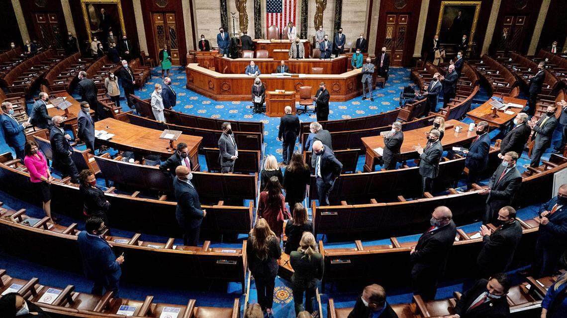 Electoral College votes are returned to a joint session of Congress hours after a mob supporting President Donald Trump broke into the Capitol and disrupted the proceedings, in Washington on Wednesday, Jan. 6, 2021. Some scientists fear that the mayhem on Capitol Hill may have been a so-called super-spreading event.