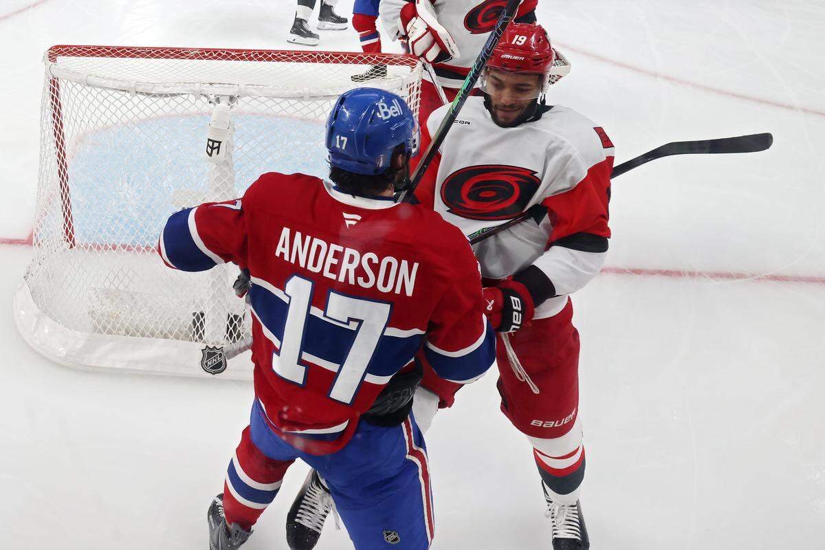 Josh Anderson (17) of the Montreal Canadiens and K'andre Miller of the Carolina Hurricanes come together during the third period in Game 4 of the Eastern Conference Final of the 2026 Stanley Cup Playoffs at Bell Centre on May 27, 2026 in Montreal, Quebec, Canada.