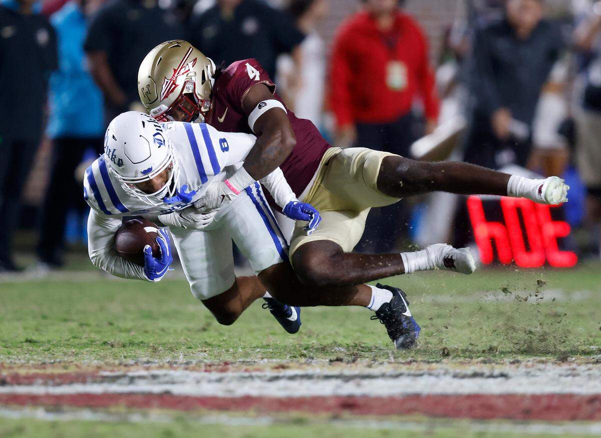Duke’s Jordan Moore is brought down by Florida State’s Kalen DeLoach during the second half of the Blue Devils’ 38-20 loss on Saturday, Oct. 21, 2023, in Tallahassee, Fla.