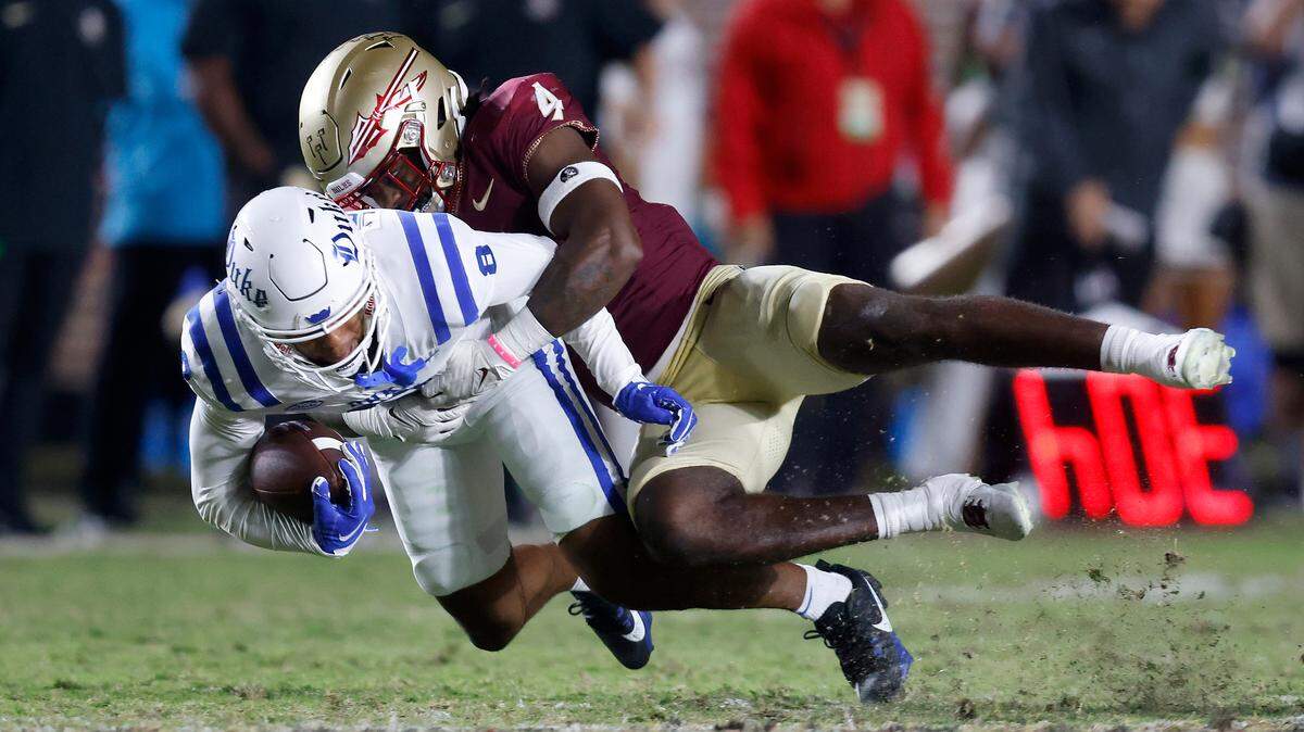 Duke’s Jordan Moore is brought down by Florida State’s Kalen DeLoach during the second half of the Blue Devils’ 38-20 loss on Saturday, Oct. 21, 2023, in Tallahassee, Fla.