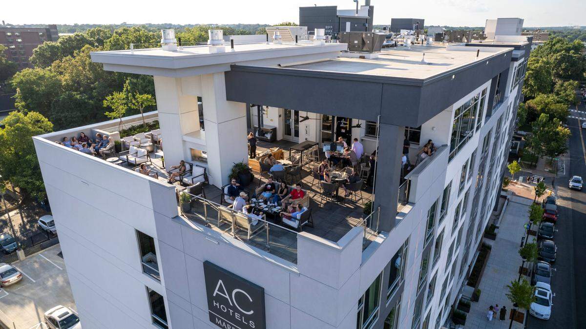 An aerial view of The Willard rooftop bar atop the AC Hotel Downtown Raleigh on Glenwood Avenue.