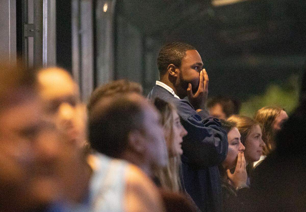 A Tar Heel fan watches in suspense in the final moments of UNC’s Final Four game against Duke at Top of the Hill in Chapel Hill, N.C. on Saturday, April 2, 2022.