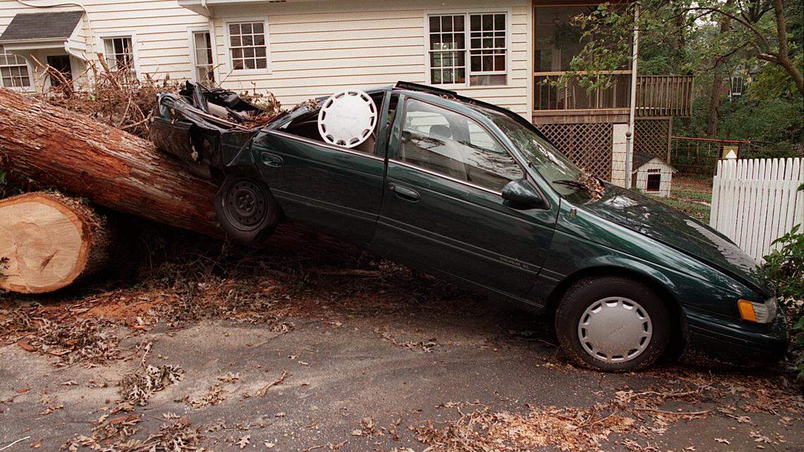 The city of Raleigh is opening up city-owned parking decks for residents who want to protect their cars from damage from falling trees and debris during Hurricane Florence. This car on Anderson Drive was destroyed by a falling tree during Hurricane Fran in 1996.