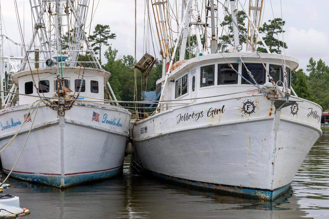Boats are moored along Wheeler Creek in Sneads Ferry in an area near Camp Lejeune with multiple commercial fishing businesses.