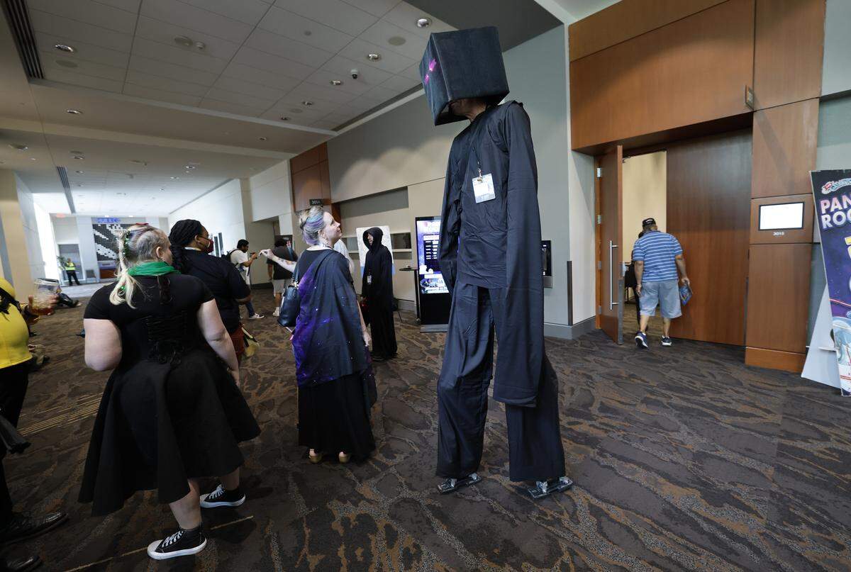 Jeff Holmes of Raleigh walks the hallways dressed as an enderman from Minecraft during GalaxyCon Raleigh at the Raleigh Convention Center Sunday, July 27, 2025.