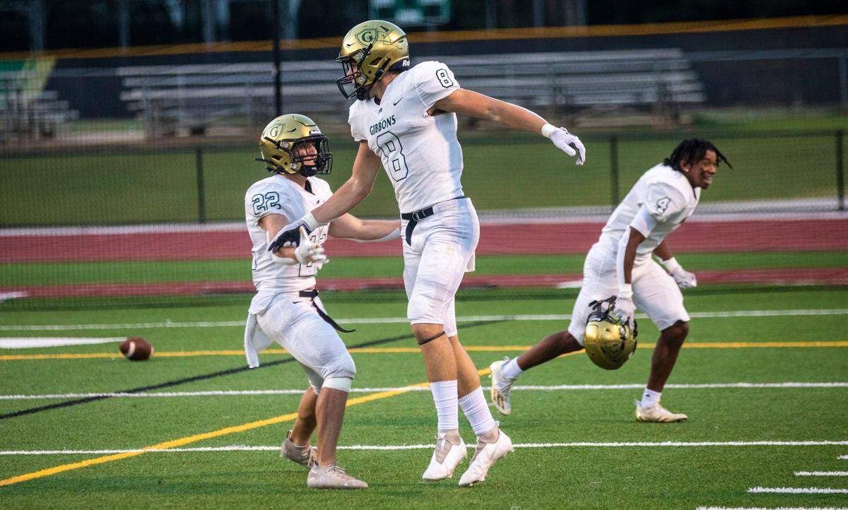 Cardinal Gibbonss Jake Taylor (8) celebrates a touchdown during the first half against Wake Forest Friday, Sept. 10, 2021 at Cardinal Gibbons High School in Raleigh. Cardinal Gibbons won 33-9.