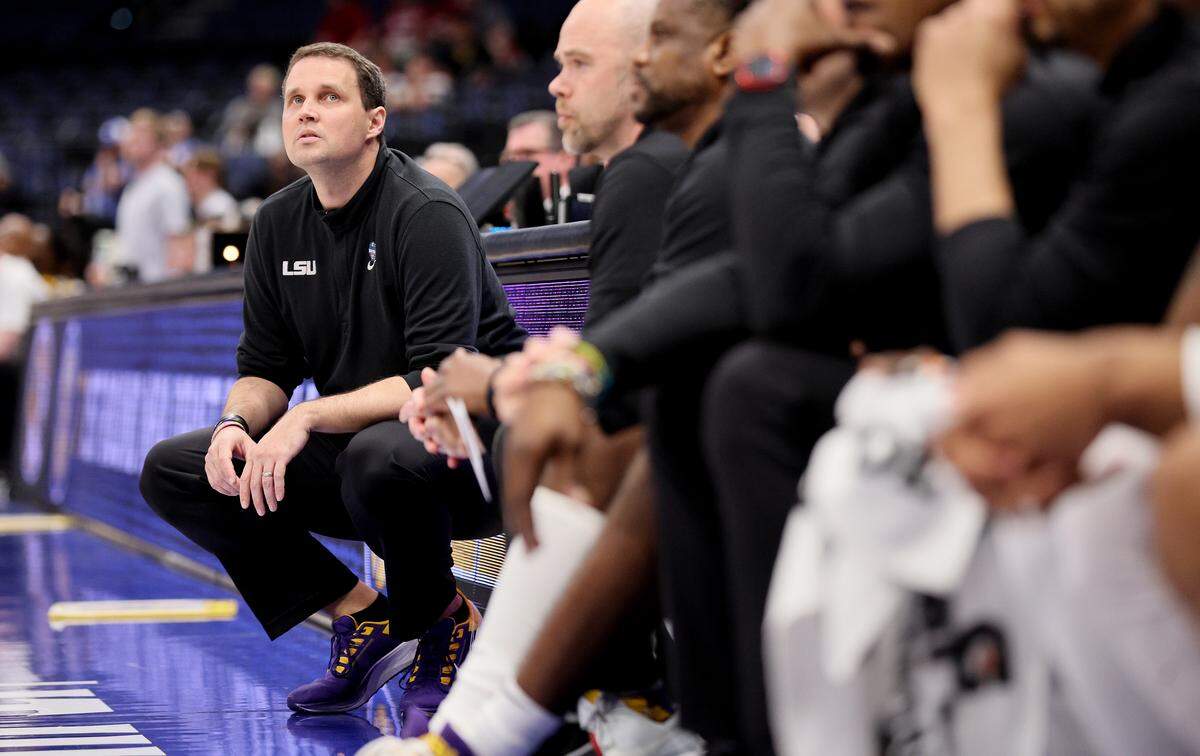 Will Wade, on March 10, 2022 when he was head coach of LSU, crouches on the sideline during a game against the Missouri Tigers in the second round of the SEC Tournament at Amalie Arena in Tampa, Florida.