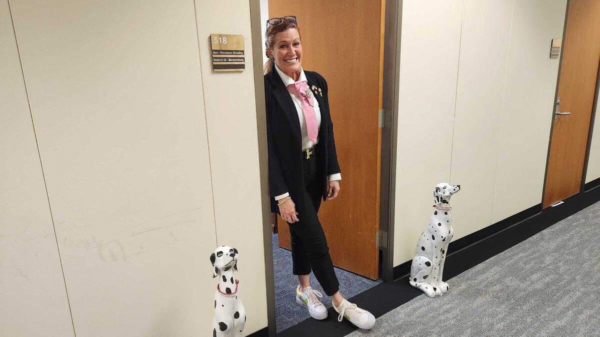 N.C. Sen. Woodson Bradley, a Mecklenburg County Democrat and freshman for the 2025-26 legislative session, pictured outside her office in the Legislative Office Building. She places two Dalmatian statues outside her door during session days.
