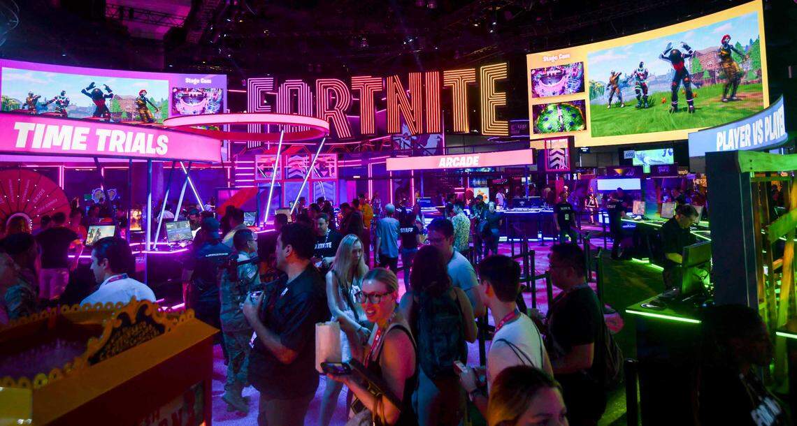 E3 participants walk through the Fortnite section of the wing at the 2019 Electronic Entertainment Expo (E3) at the Los Angeles Convention Center.